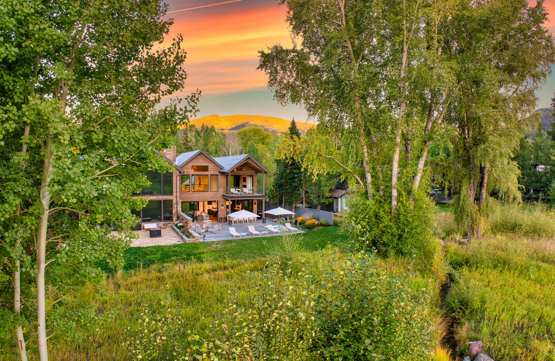 Exterior of home and yard at sunset